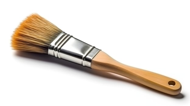 Small paint brush isolated on white background studio shot. photo