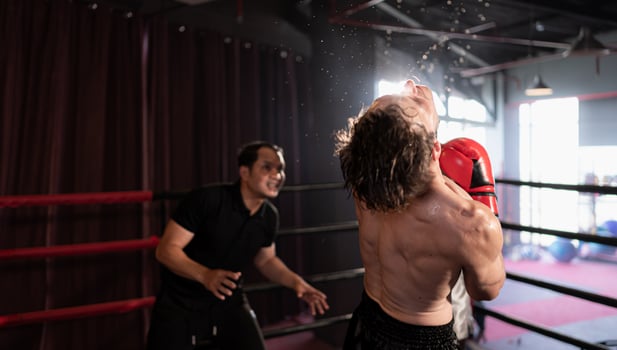 The power of the punch that hits the opponent's face can make faces look up and get knocked out, Muay Thai, Thai martial arts. photo