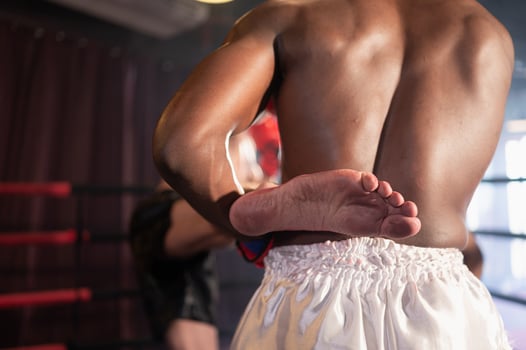 Using the feet is one of the master techniques of Muay Thai that is used to kick and lift to prevent kicks. which boxers are popularly used as weapons, Muay Thai,Thai martial arts. photo