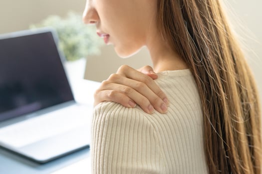 Body muscles stiff problem, ache asian young woman, girl pain neck while sitting work on chair at home, holding massaging rubbing, hurt or sore, Healthcare people, office syndrome . photo