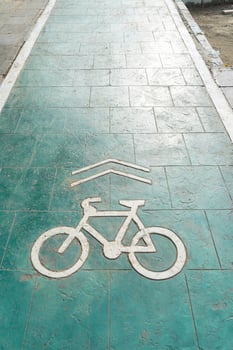 bicycle lane, traffic, city transportation and eco-friendly concept, green bicycle lane with bicycle signs photo