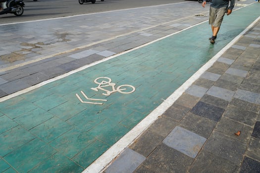 bicycle lane, traffic, city transportation and eco-friendly concept, green bicycle lane with bicycle signs photo