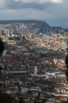 Aerial view of Quito from cerro El Panecillo. White building at Plaza grande photo