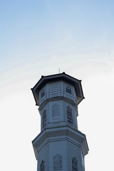 Purwakarta, 05 May 2023 - View of the minaret of the Tajug Gede Cilodong Mosque against a blue sky as a background, located in Cilodong, Purwakarta photo