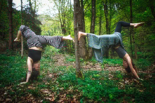 Acrobatic yoga practiced by young female couple photo