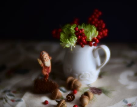 Still life Christmas with antique Santa and flowers photo