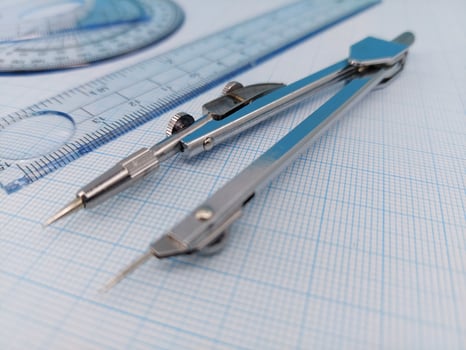Compass and protractor for math and engineers or architect photo
