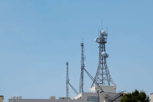 telecommunication  mast TV antennas wireless technology with blue sky in the morning photo