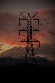 Power tower against a dramatic beautiful sunset sky photo