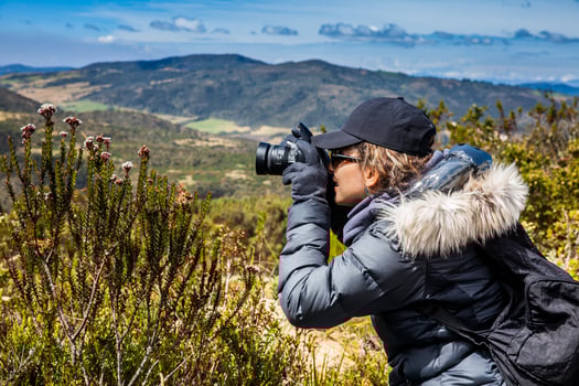 Young woman exploring the nature of a beautiful paramo at the department of Cundinamarca in Colombia photo