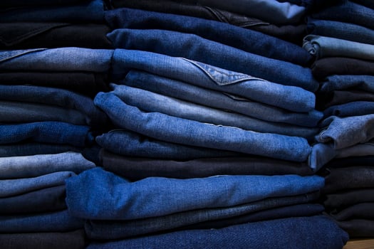 folded blue jeans pant pattern texture can be used as a background wallpaper photo