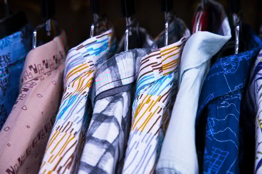 Colorful variety of Shirts  hangings in a clothing Showroom. Cluse-up Focus photo
