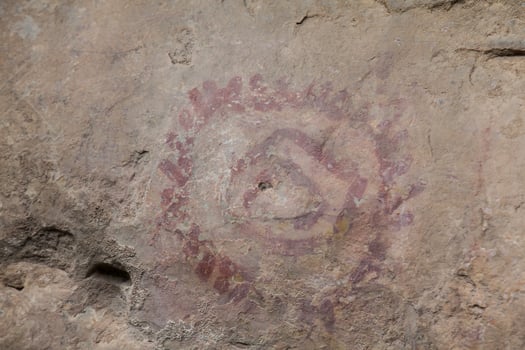 Prehistoric paintings on rock known as petroglyphs in Colombia photo