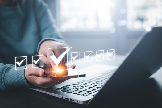 Businessman hold Smartphone with Taking assessment, questionnaire, evaluation, online survey online exam Choosing the right answer in exam by filling out the online survey form,Answer  test questions photo