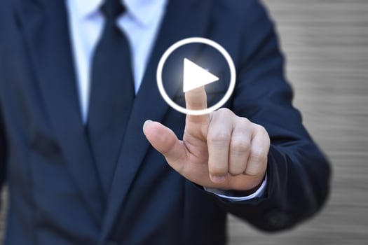Businessman pressing play button to start. Idea for business, technology and presentation. photo