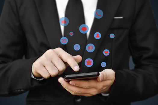 Close-up of businessman hands using mobile smartphone with social media icon. Idea for business, online marketing and technology. photo