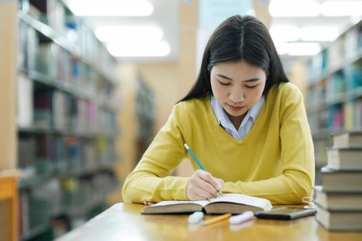 Student studying at library. photo