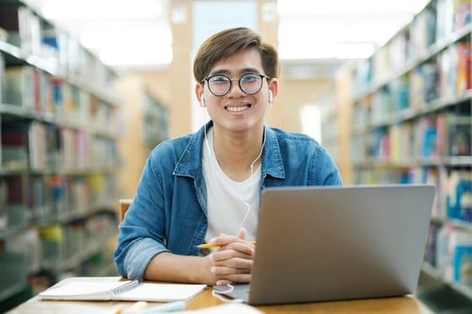 Student studying at library. photo