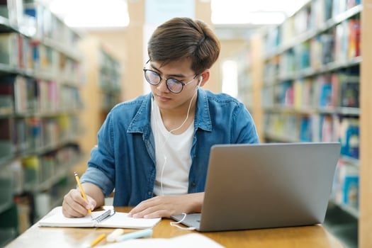 Student studying at library. photo