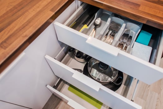 Kitchen Drawers With Convenient Compartments For Cooking Gadgets. photo