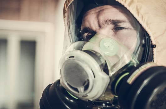 Tired Men in Safety Biohazard Mask Covering His Face photo