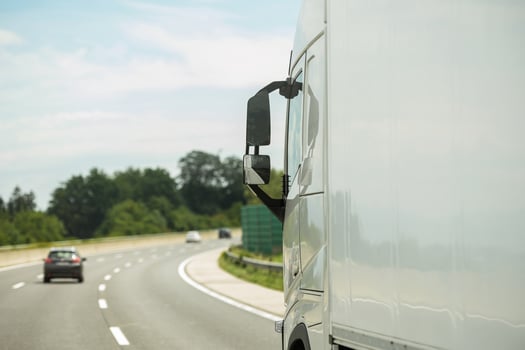 Modern Semi Truck on a Highway Right Before Strong Curve photo