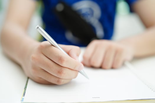 Asian teenage student write homework, study lesson for exam online learning education. photo