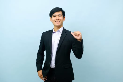 Portrait of businessman pointing thumb at himself. photo