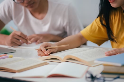 Young asian students campus helps friend catching up and learning. photo