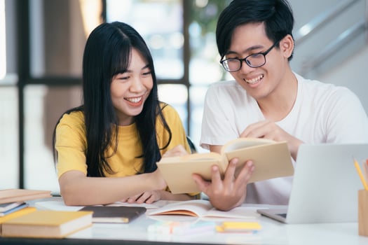 Young students campus helps friend catching up and learning. photo
