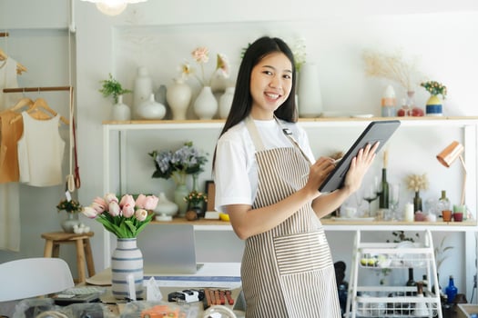 Businesswoman Home delivery service and working service mind checking inventory in stock room. photo