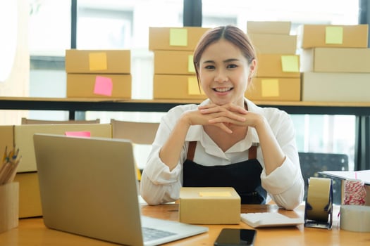 Asian businesswoman happy Home delivery service and working service mind. photo