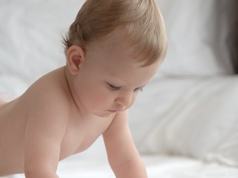 Baby Crawling on The Bed photo
