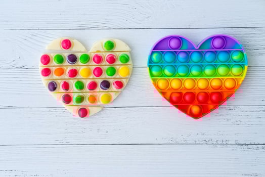 Use the popular pop it toy as a chocolate mold. White chocolate and colorful candies and popit silicone toy. DIY concept. Step-by-step photo instructions. Step 10.