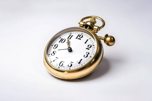 golden alarm clock on a white background. photo
