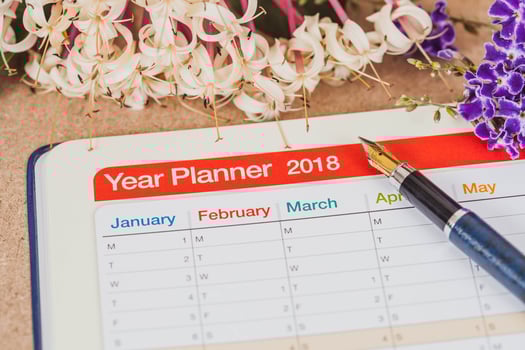 personal organizer or planner with fountain pen on wood table. photo