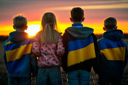 Futures of Freedom Children with Ukrainian Flags Gazing at Sunset, a Hopeful Symbol of a Brighter Tomorrow photo