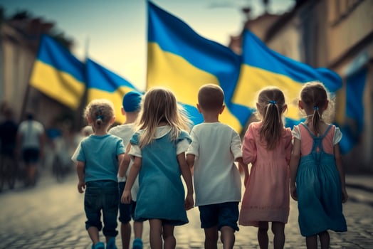Marching for Liberty Children Carrying Ukrainian Flags Through the Streets as a Symbol of Freedom photo