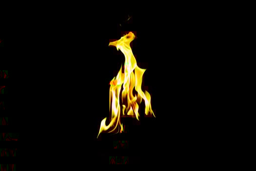 Fire flame texture. Burning material backdrop. Burn effect pattern. Blaze and torch wallpaper. Heat and haze backdrop. photo