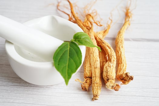 Ginseng roots and green leaf, healthy food. photo