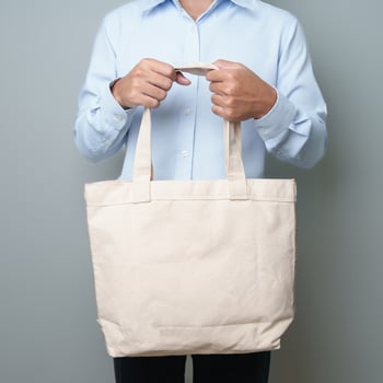 man with Eco Shopping tote bag with Copy space for text. Environmental Protection, Zero waste, Reusable, Say No Plastic, Sustainability, Eco Friendly, World Environment day and Earth day concept photo