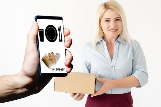 Hand holding mobile with Order food with white background, Order food online business concept. photo