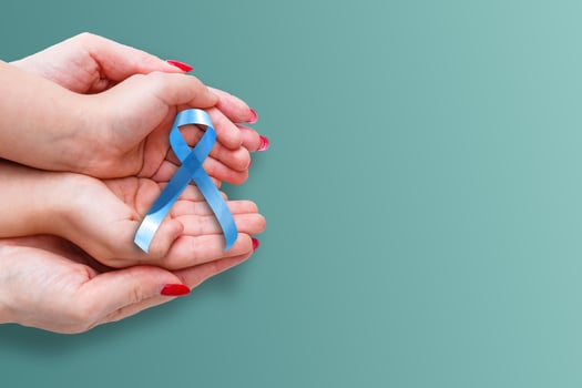 blue ribbon representing an annual event during the month of November to raise awareness of men's health issues and prostate cancer with copy space photo
