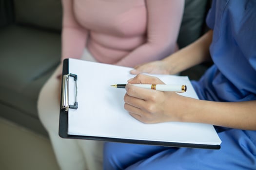 Physical therapists are advising elderly person to get them to do physical therapy at regular intervals. concept of giving advice and encouragement to an elderly person doing physiotherapy. photo