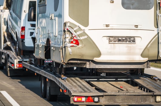 Damaged Camper Vans RV Towed Away to a Repair Shop photo