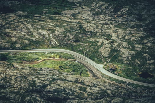 Norwegian Road Through the Rocky Mountain Landscape Aerial View photo