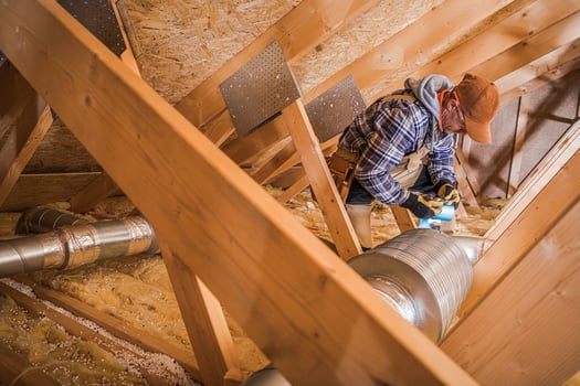 HVAC Technician Installing Air Duct Filter photo