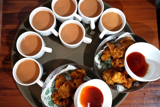 Milk Tea with Vegetable snacks and Ketchup photo