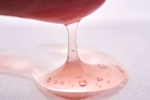The texture of a pink viscous cosmetic. photo