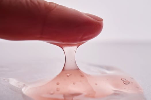 The texture of a pink viscous cosmetic. photo